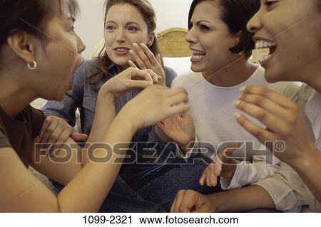 Stock Image - multiethnic, women, people, talking, enthusiastic, curious. Fotosearch