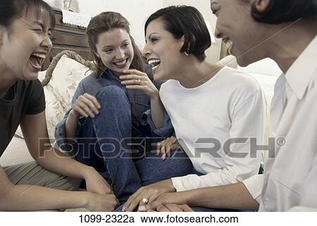 Stock Image - multiethnic, women, people, talking, sitting, enthusiastic. Fotosearch