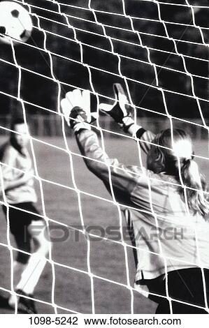 Stock Image - net, competition, reaching, opponent, soccer, goalie, save. Fotosearch
