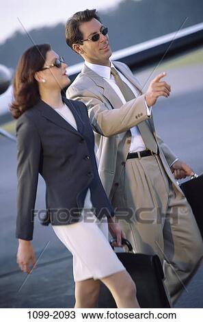 outdoors, walking, business, pointing, sunglasses, point, airplane View Large Photo Image Stock Image - outdoors, walking, business, pointing, sunglasses, point, airplane. Fotosearch