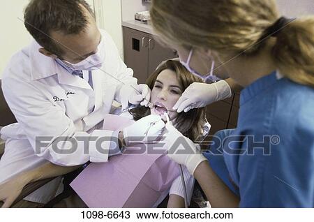 Stock Image - patient, dentist, doctor, equipment, tools, health, checking. Fotosearch