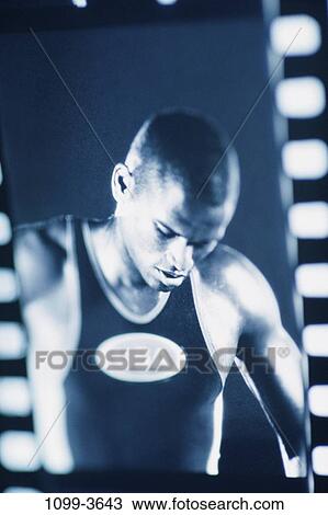 Stock Image - people, American, running, concentration, concentrating, outdoors. Fotosearch