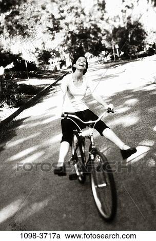 people, balance, woman, bicycle, laughing, riding, outdoors View Large Photo Image Stock Image - people, balance, woman, bicycle, laughing, riding, outdoors. Fotosearch