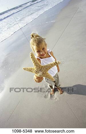 Stock Photo - people, beach, girl, outdoors, adventurous, outings, vacation. Fotosearch