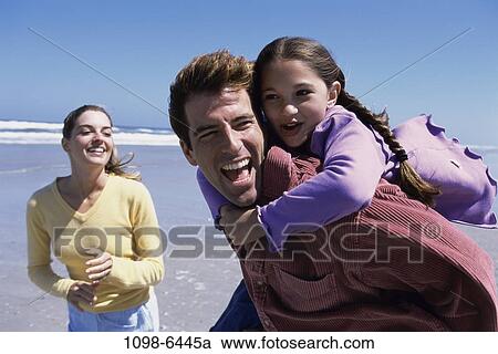 people, beach, playful, carrying, family, daughter View Large Photo Image Stock Image - people, beach, playful, carrying, family, daughter. Fotosearch