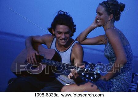 people, couple, blue, music, teens, brunette View Large Photo Image Stock Image - people, couple, blue, music, teens, brunette. Fotosearch