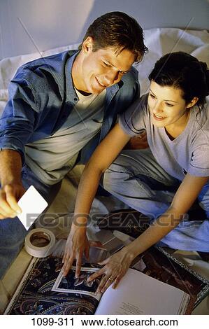 people, couple, choices, Hispanic, new home, indoors, Caucasian View Large Photo Image Stock Image - people, couple, choices, Hispanic, new home, indoors, Caucasian. Fotosearch