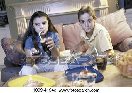 people, couple, entertainment, watching, television, teens View Large Photo Image Stock Image - people, couple, entertainment, watching, television, teens. Fotosearch