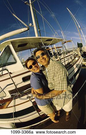 Stock Image - people, couple, excitement, excited, sunglasses, boating, outdoors. Fotosearch