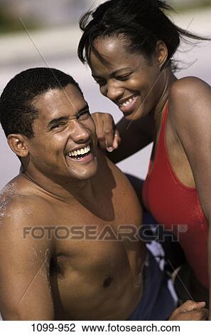 people, couple, friendship, happy, beach, playful, lifestyles View Large Photo Image Stock Image - people, couple, friendship, happy, beach, playful, lifestyles. Fotosearch