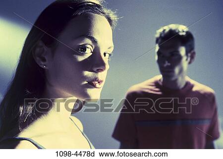 Stock Image - people, couple, Hispanic, serious, apart, brunette. Fotosearch