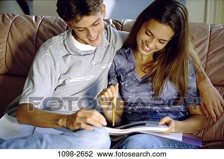 people, couple, homework, couch, studying, embracing, embrace View Large Photo Image Stock Image - people, couple, homework, couch, studying, embracing, embrace. Fotosearch