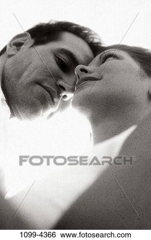 Stock Photograph - people, couple, leaning, grainy, outdoors, commitment, beginnings. Fotosearch