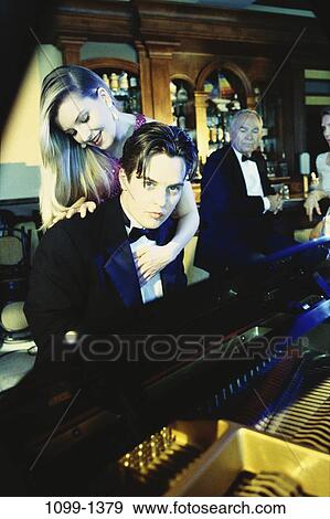 people, couple, music, piano, flirting, bar, entertainment View Large Photo Image Stock Photo - people, couple, music, piano, flirting, bar, entertainment. Fotosearch