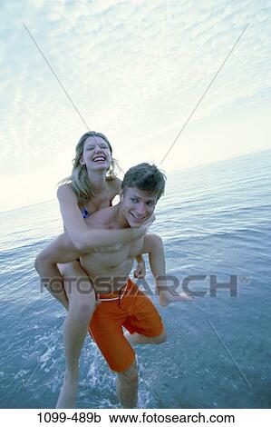 people, couple, ocean, beach, joyous, joy, Caucasian View Large Photo Image Stock Image - people, couple, ocean, beach, joyous, joy, Caucasian. Fotosearch