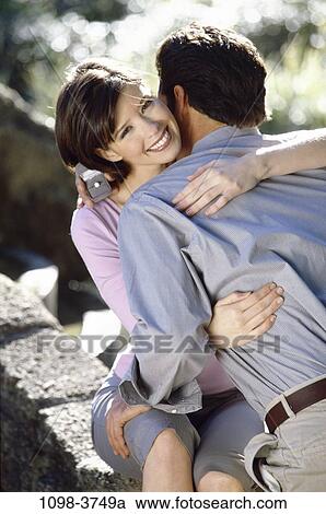people, couple, outdoors, romantic, hugging, commitment, unity View Large Photo Image Stock Image - people, couple, outdoors, romantic, hugging, commitment, unity. Fotosearch