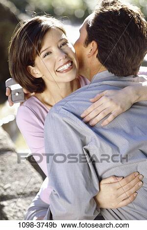 people, couple, outdoors, romantic, hugging, commitment, unity View Large Photo Image Stock Image - people, couple, outdoors, romantic, hugging, commitment, unity. Fotosearch