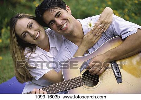 people, couple, outdoors, young adult, Young couples outdoors View Large Photo Image Stock Image - people, couple, outdoors, young adult, Young couples outdoors. Fotosearch