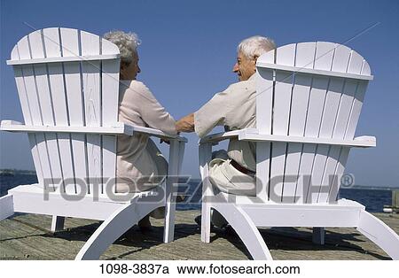 people, couple, senior, beach, outdoors, chairs, vacation View Large Photo Image Stock Image - people, couple, senior, beach, outdoors, chairs, vacation. Fotosearch