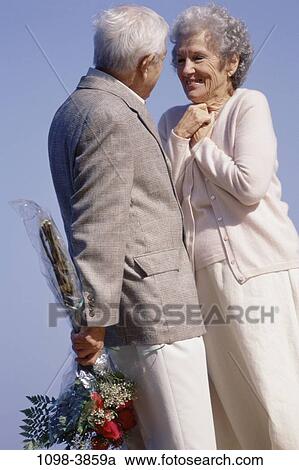 people, couple, senior, flowers, outdoors, surprise, anticipation View Large Photo Image Stock Image - people, couple, senior, flowers, outdoors, surprise, anticipation. Fotosearch