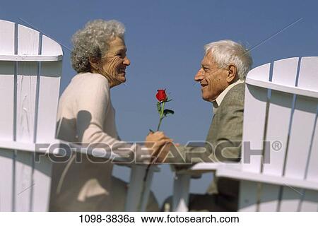 people, couple, senior, rose, flower, outdoors, chairs View Large Photo Image Stock Image - people, couple, senior, rose, flower, outdoors, chairs. Fotosearch