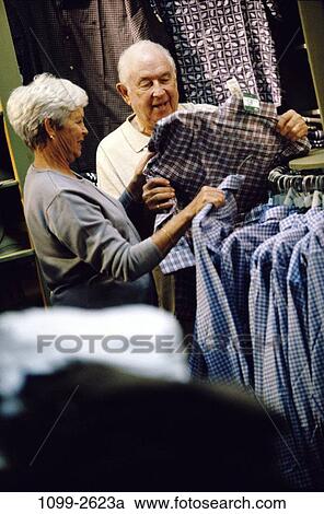 Stock Image - people, couple, senior, shopping, shop, clothes, Caucasian. Fotosearch