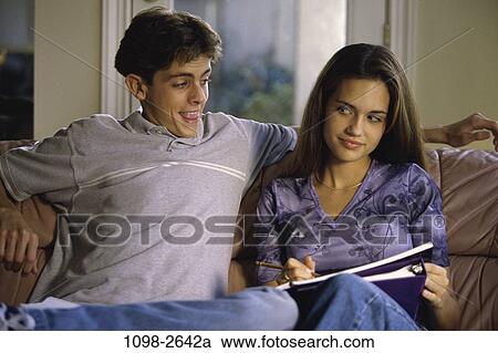 Stock Image - people, couple, studying, teens, brunette, annoying. Fotosearch