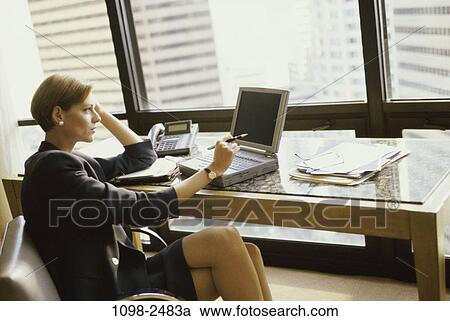 people, desk, computer, laptop, business, brunette, indoors View Large Photo Image Stock Image - people, desk, computer, laptop, business, brunette, indoors. Fotosearch