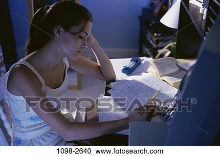 people, desk, home, night, sitting, concentration View Large Photo Image Stock Image - people, desk, home, night, sitting, concentration. Fotosearch
