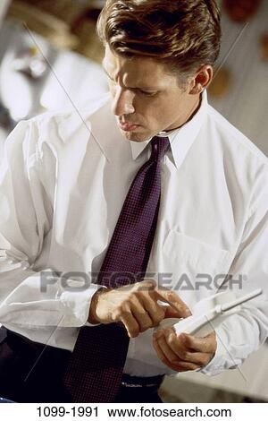 Stock Image - people, dial, dialing, telephone, phone, holding. Fotosearch