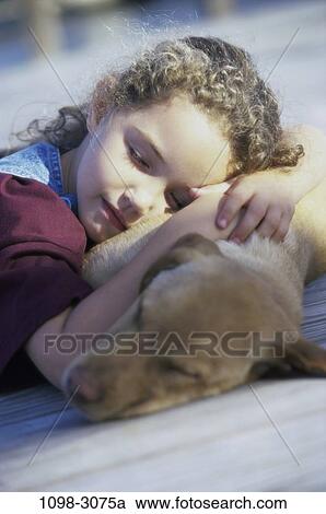 Stock Image - people, dog, sleeping, pet, girl, outdoors, resting. Fotosearch