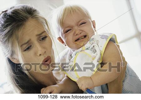 people, eating, face, mother, baby, crying View Large Photo Image Stock Photo - people, eating, face, mother, baby, crying. Fotosearch