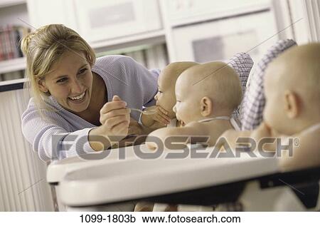 people, eating, mother, spoon, challenges, family, blond View Large Photo Image Stock Image - people, eating, mother, spoon, challenges, family, blond. Fotosearch