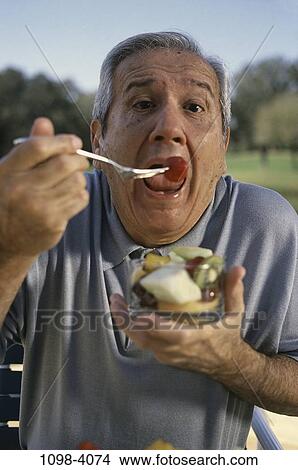 people, eating, senior, open, fork, fruit View Large Photo Image Picture - people, eating, senior, open, fork, fruit. Fotosearch