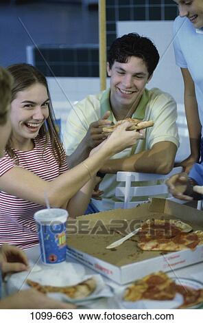 people, eating, smiling, table, sitting, pizza View Large Photo Image Stock Image - people, eating, smiling, table, sitting, pizza. Fotosearch