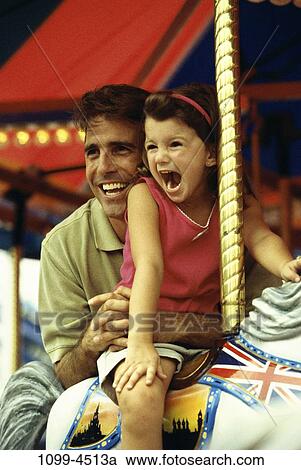 people, excitement, riding, carnival, outdoors, amusement, hugging View Large Photo Image Stock Image - people, excitement, riding, carnival, outdoors, amusement, hugging. Fotosearch