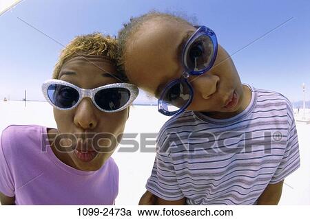 people, faces, mother, beach, sunglasses, lips, family View Large Photo Image Stock Image - people, faces, mother, beach, sunglasses, lips, family. Fotosearch