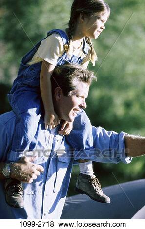 Stock Photo - people, family, affection, father, daughter, bonding, Fathers outdoors. Fotosearch