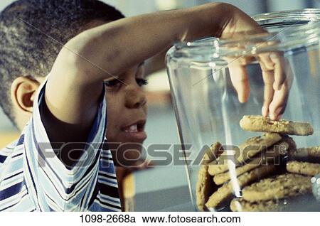 people, hand, eating, boy, child, reaching, grabbing View Large Photo Image Stock Image - people, hand, eating, boy, child, reaching, grabbing. Fotosearch