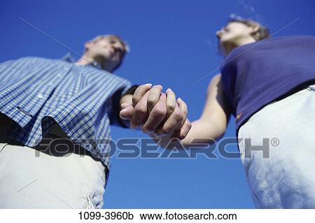 people, hands, couple, blue, holding, outdoors View Large Photo Image Stock Image - people, hands, couple, blue, holding, outdoors. Fotosearch