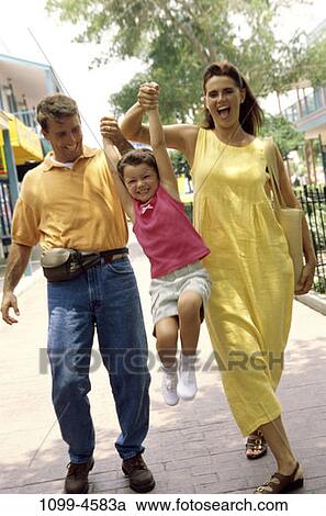people, hands, walking, happy, laughing, swinging, holding View Large Photo Image Stock Image - people, hands, walking, happy, laughing, swinging, holding. Fotosearch