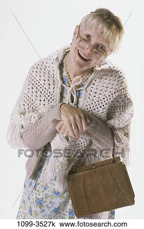 people, hands, woman, smiling, eyeglasses, senior, purse View Large Photo Image Stock Image - people, hands, woman, smiling, eyeglasses, senior, purse. Fotosearch