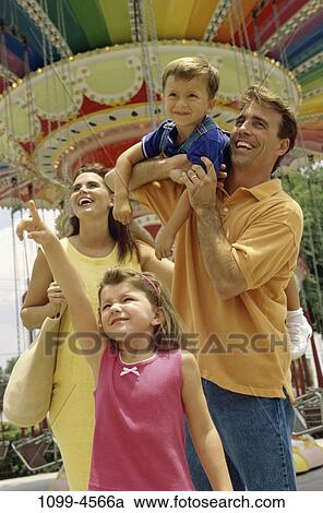 people, happy, pointing, outdoors, park, amusement, point View Large Photo Image Stock Image - people, happy, pointing, outdoors, park, amusement, point. Fotosearch