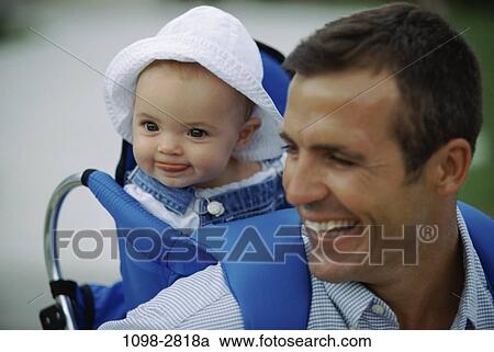 Stock Image - people, hat, baby, laughing, outdoors, individuality, future. Fotosearch