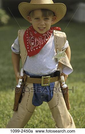 Stock Image - people, hat, boy, outdoors, bandana, serious, child. Fotosearch