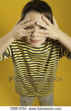 people, hiding, boy, child, peeking, frightened, brunette View Large Photo Image Picture - people, hiding, boy, child, peeking, frightened, brunette. Fotosearch