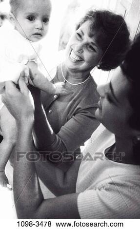 people, Hispanic, family, generations, daughters, wiping, brunette View Large Photo Image Stock Photo - people, Hispanic, family, generations, daughters, wiping, brunette. Fotosearch