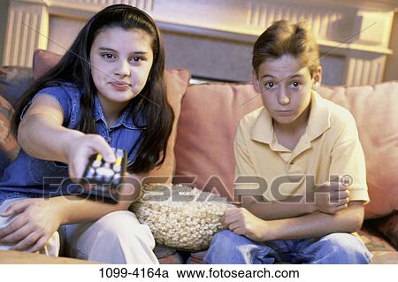people, home, couple, popcorn, entertainment, television View Large Photo Image Stock Image - people, home, couple, popcorn, entertainment, television. Fotosearch