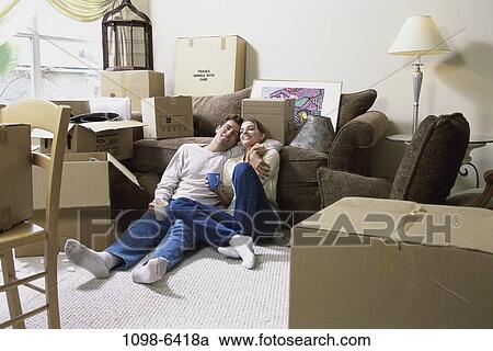 people, home, moving, couple, sitting, resting View Large Photo Image Stock Image - people, home, moving, couple, sitting, resting. Fotosearch