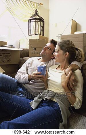 people, home, moving, couple, sitting, resting, boxes View Large Photo Image Stock Image - people, home, moving, couple, sitting, resting, boxes. Fotosearch